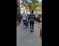 Man stripe shirt spins ball on finger Part 1