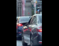 Mans foot peeking out window while driving