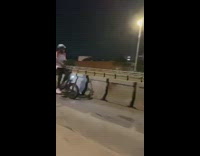 Orange vest guy bicycle pulls cart containers 