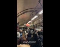 Passengers crowding subway station escalators