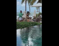 Woman in bikini teaches man how to take her picture