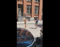 Woman in Aztec plays the violin at the street