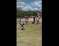 Woman cheerleader stand at the El Castillo