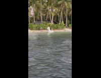 Girl brings pool float to beach