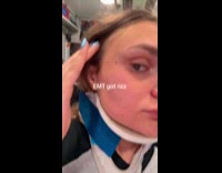 Woman in ambulance checking herself for good looking EMT