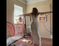 Woman rolls hula hoop arms picture breaks