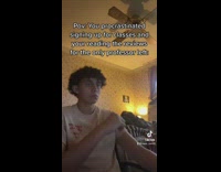 Guy white shirt sitting in room reading hand on chin