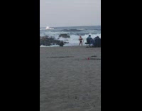 Girl black bikini split jump shot beach