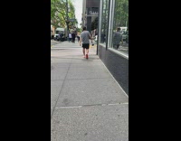 Man grey shirt walk street hold plunger