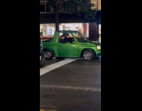 Collab WINY - Two men ride small green pickup truck