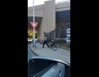 Collab WINY - Artist mouth covered with boxing gloves on street