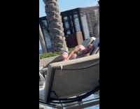 Man sleeps in sunbed near women photoshoot