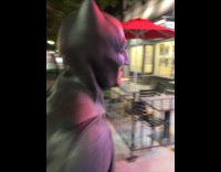 Men in batman and robin costume pranks diner