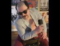 Bald guy sings red aeropostale sweatpants 