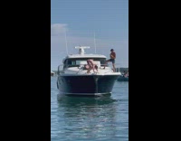 Man shirtless pushups on the bow of the yacht