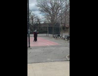 Couple wearing face masks slow dance park 
