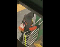 Guy wearing white costume mask subway station 