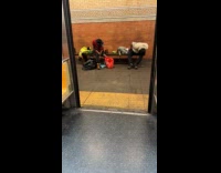 Men falls asleep on subway bench stop