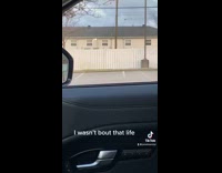 Woman yelling at man inside house with megaphone 