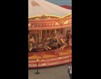 Black bathing suit girl red carousel ride 
