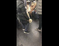 Guy carries skull on train
