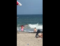 Collab IITW - Woman bikini bend for photo at beach