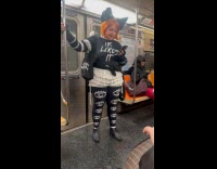 Woman on the train wearing gothic outfit 
