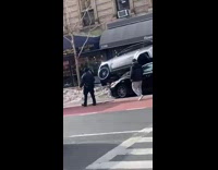 Silver SUV on top of black car