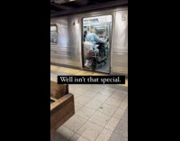 Woman enters motorcycle inside the subway train