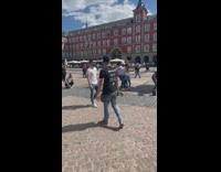 Three people dance and two guys meet plaza