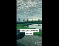 Guy gets coronavirus vaccine black face mask 