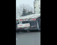 White delivery truck with student driver sign 