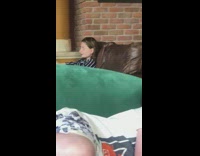 Woman striped black shirt selfie brown couch