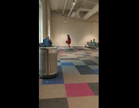 Woman long braided hair dances at airport