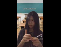 Girl black shirt classroom green screen stretch.