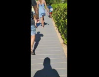 Man on the walkway dances some tiktok