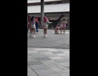 Group girls film dance video outside mall