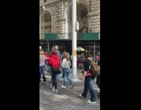 Woman takes a picture with charging bull 