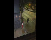 Man red pants and mask on the sidewalk for a photoshoot