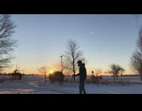 Guy throw hot water instantly frozen slowmo sunset