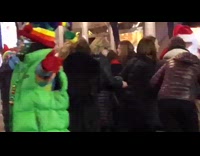 Guy standing on street wears jester pt. 2 
