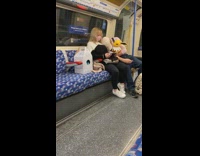 Guy sleeps holds eevee plush girl subway 