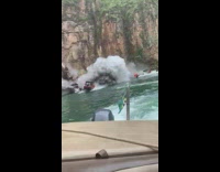 Cliff breaks and falls near boats 