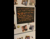Girl paints chalkboard on refrigerator hinge date 