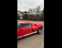 Filmer shows red old Ford at lot