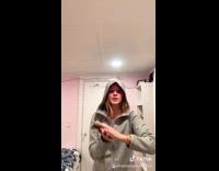 Collab BitchIG2 - Woman in grey hoodie fanning money and sliding it up her arm to music 