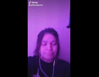 Black shirt girl lip syncs skeleton finger 