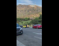 Woman white bikini lean yellow sports car Hollywood