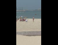 White robe camel guy photographs girl bikini