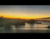 Train ride sunset river water orange sky